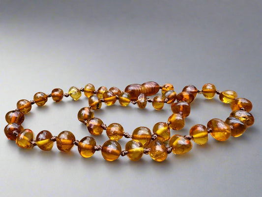 Amber necklace on a wooden surface