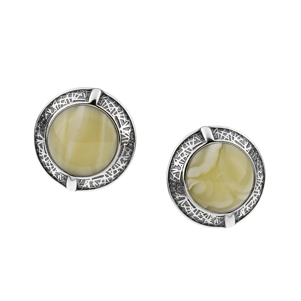 A pair of milky amber vintage earrings with a brushed silver finish and circular design.