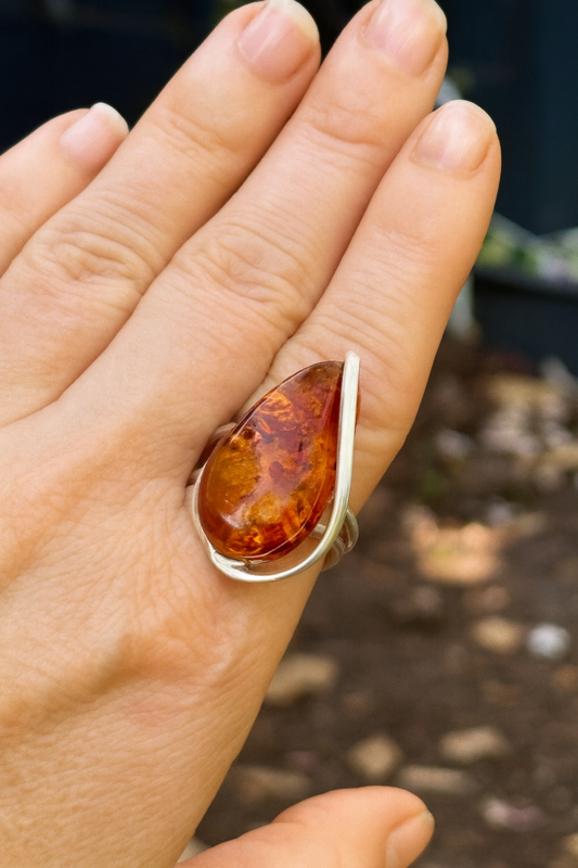 amber ring on a hand 