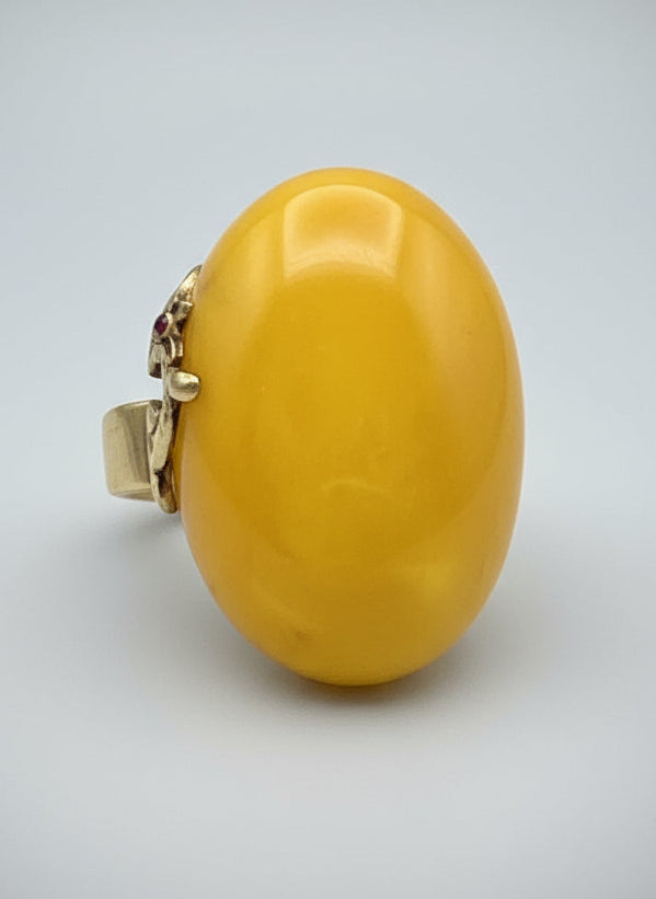 Yellow stone on a wooden surface