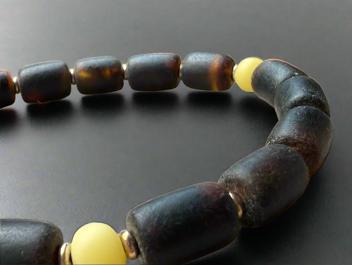 close up of Subtle White Inclusions: Black Amber Bracelet