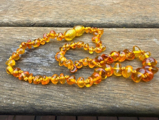 Amber necklace on a wooden surface