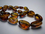 Load image into Gallery viewer, Oval Cognac Amber necklace
