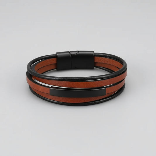 Multistrand leather bracelet with black clasp on a wooden surface