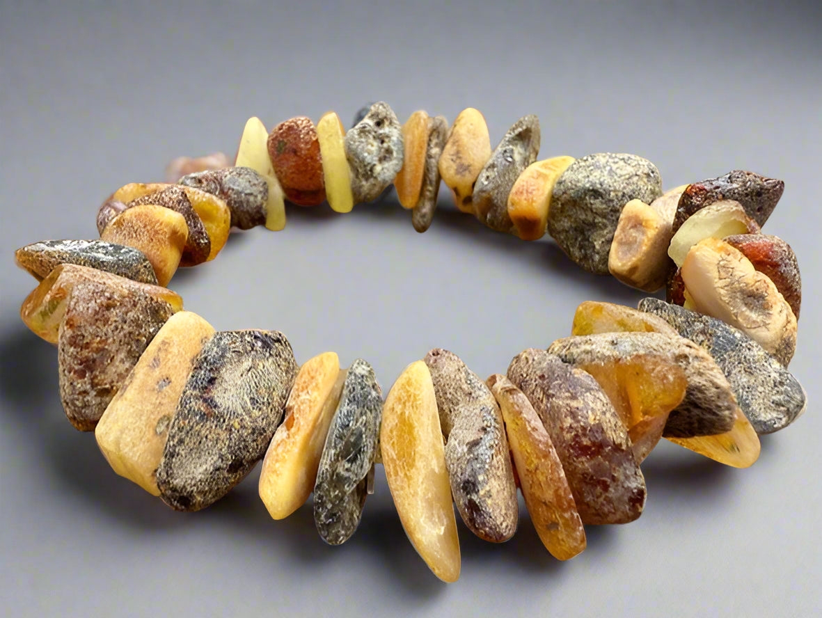 Necklace made of amber beads on a gray background