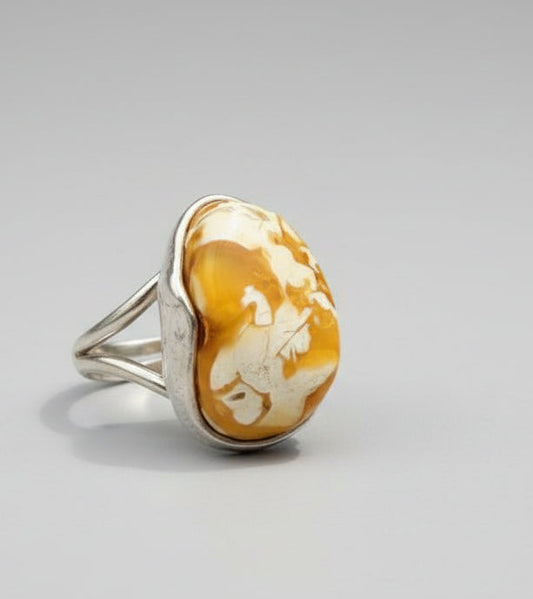 Suggestion


Silver ring with a large yellow stone on a wooden surface