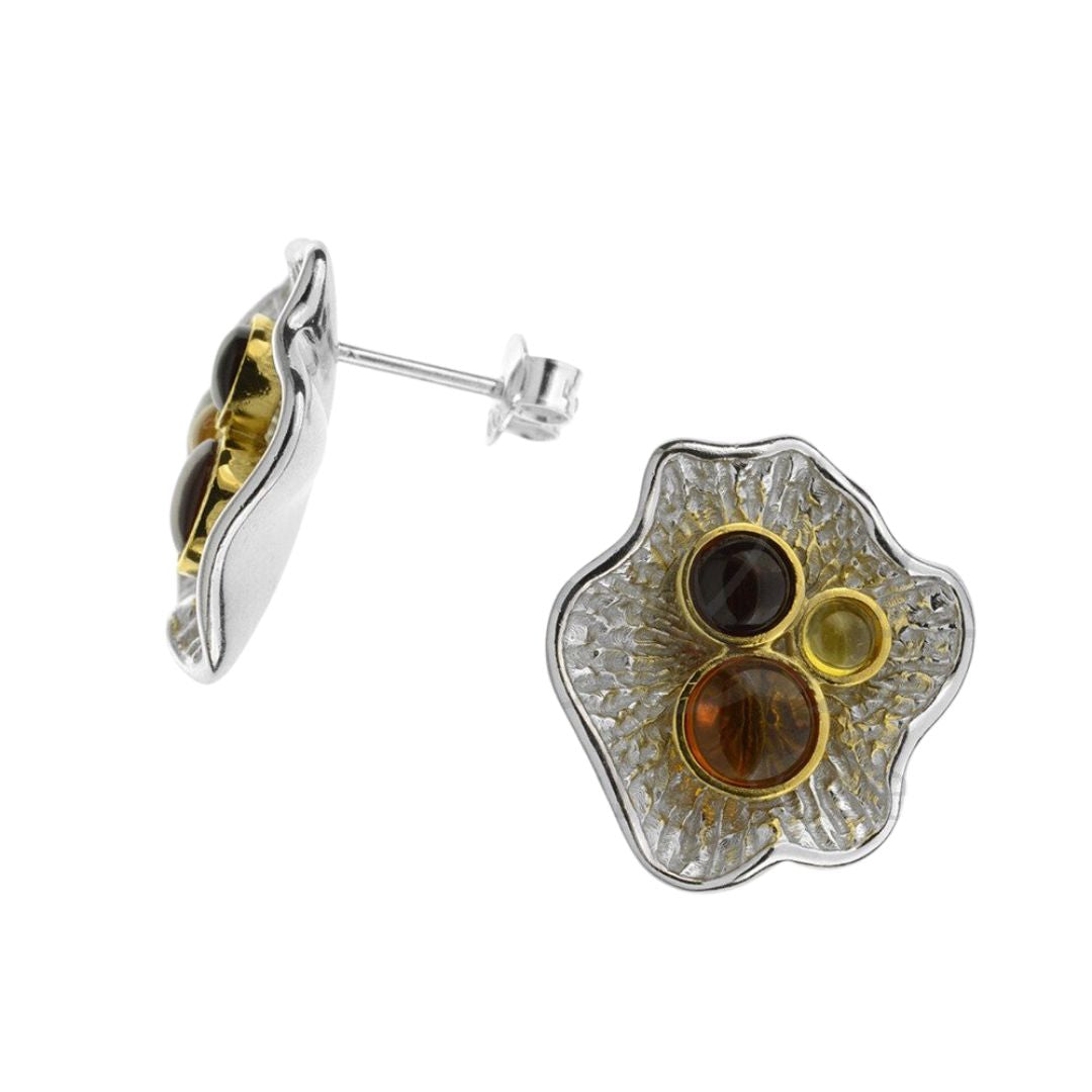 A pair of amber earrings with gold plating and sterling silver setting, showcasing three different colors of amber.